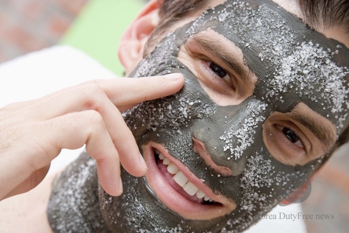 Man in skincare face mask with salt